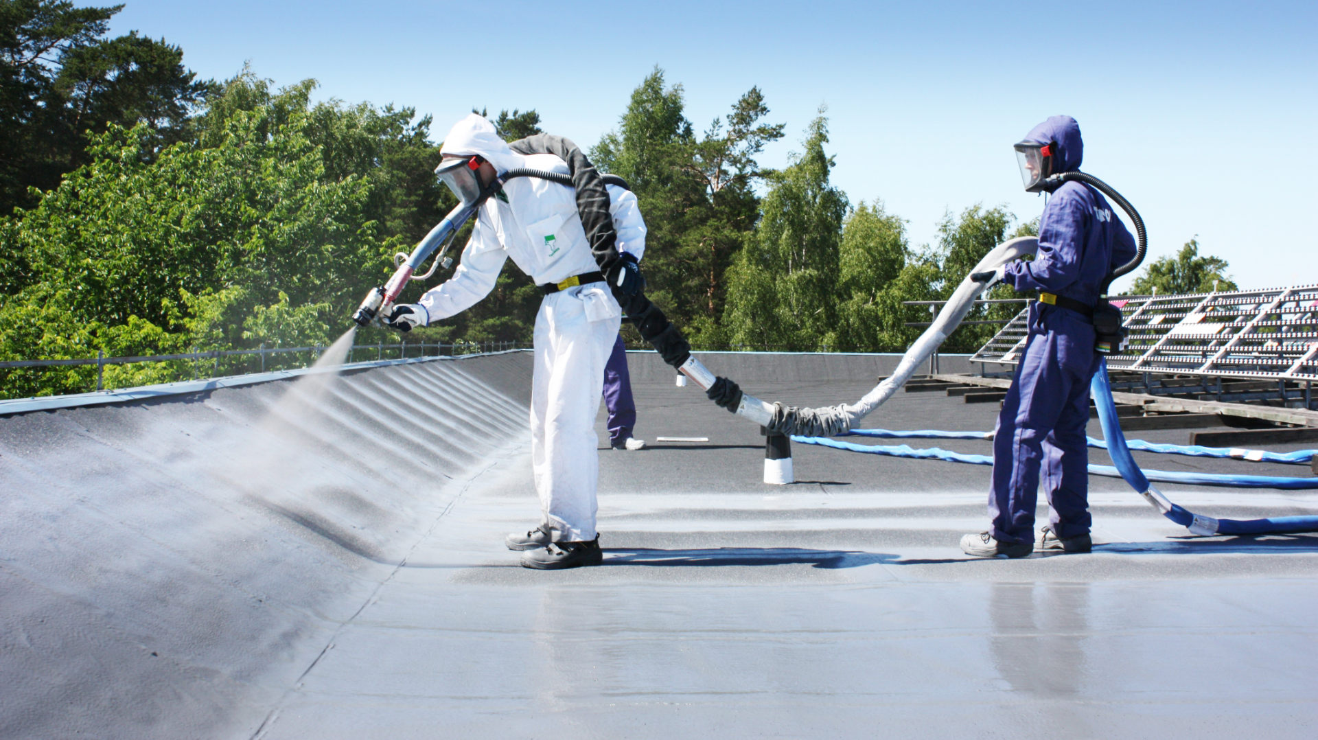 Polyurea roof coating on a commercial roof