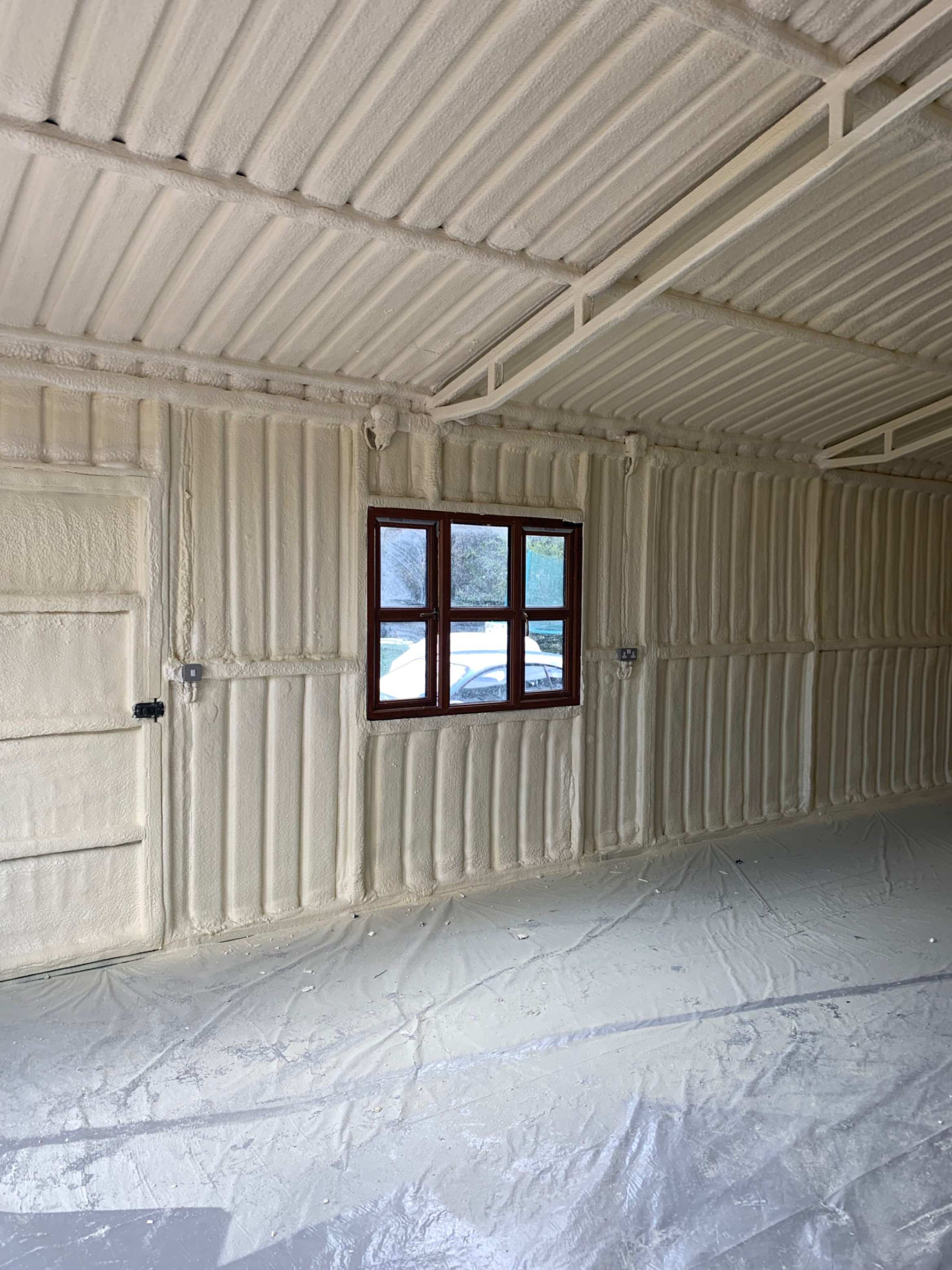 Spray foam insulation applied inside a building