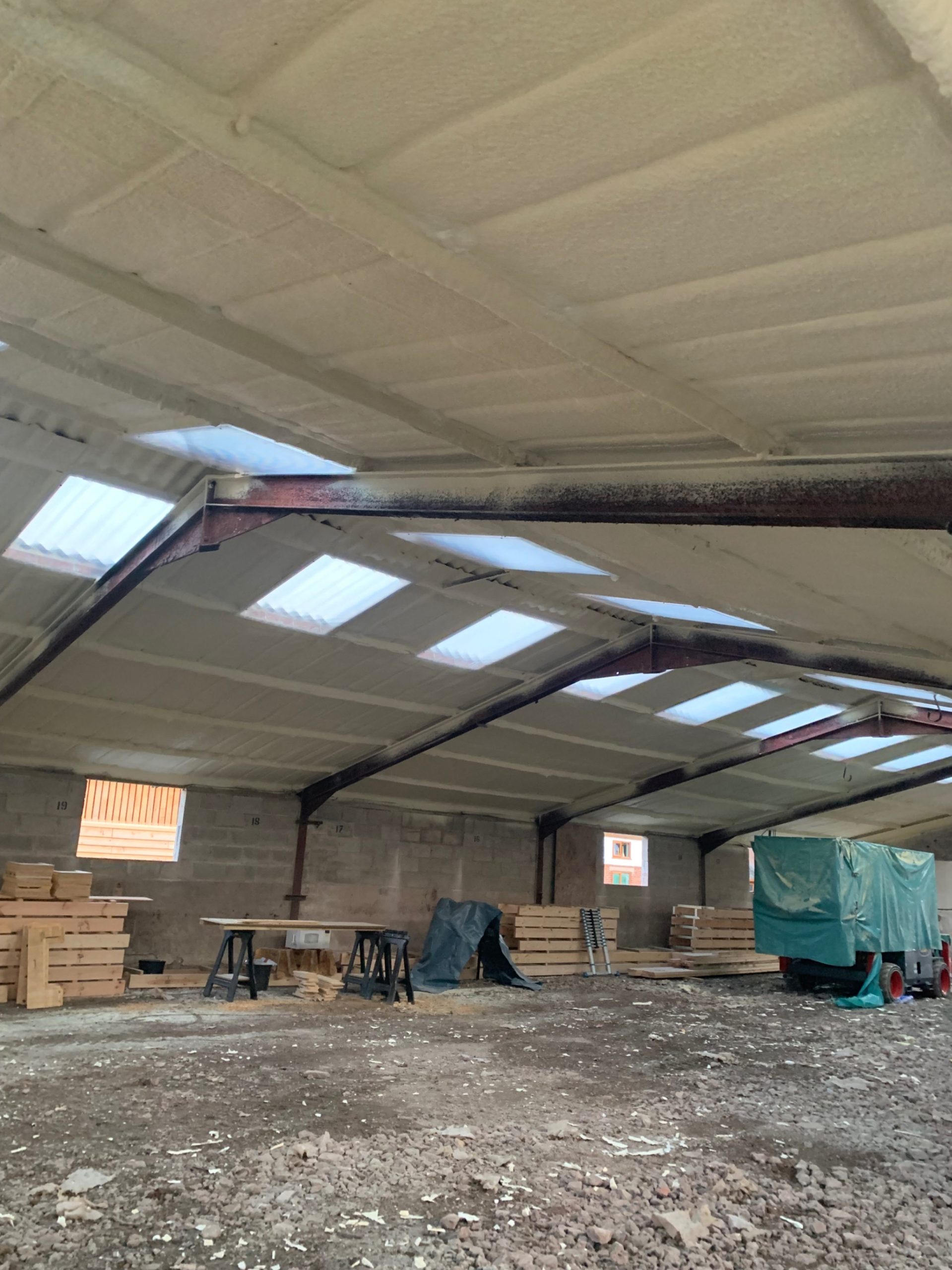 Closed-cell spray foam insulation on a warehouse interior