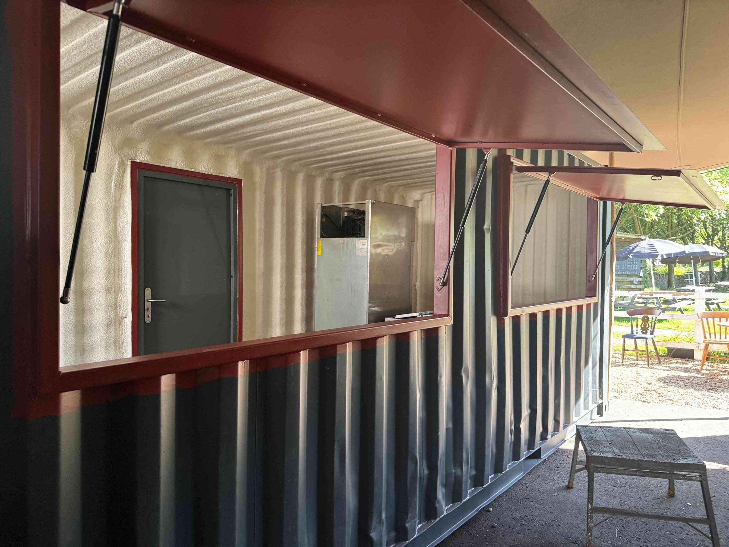 Spray foam condensation control in a metal building
