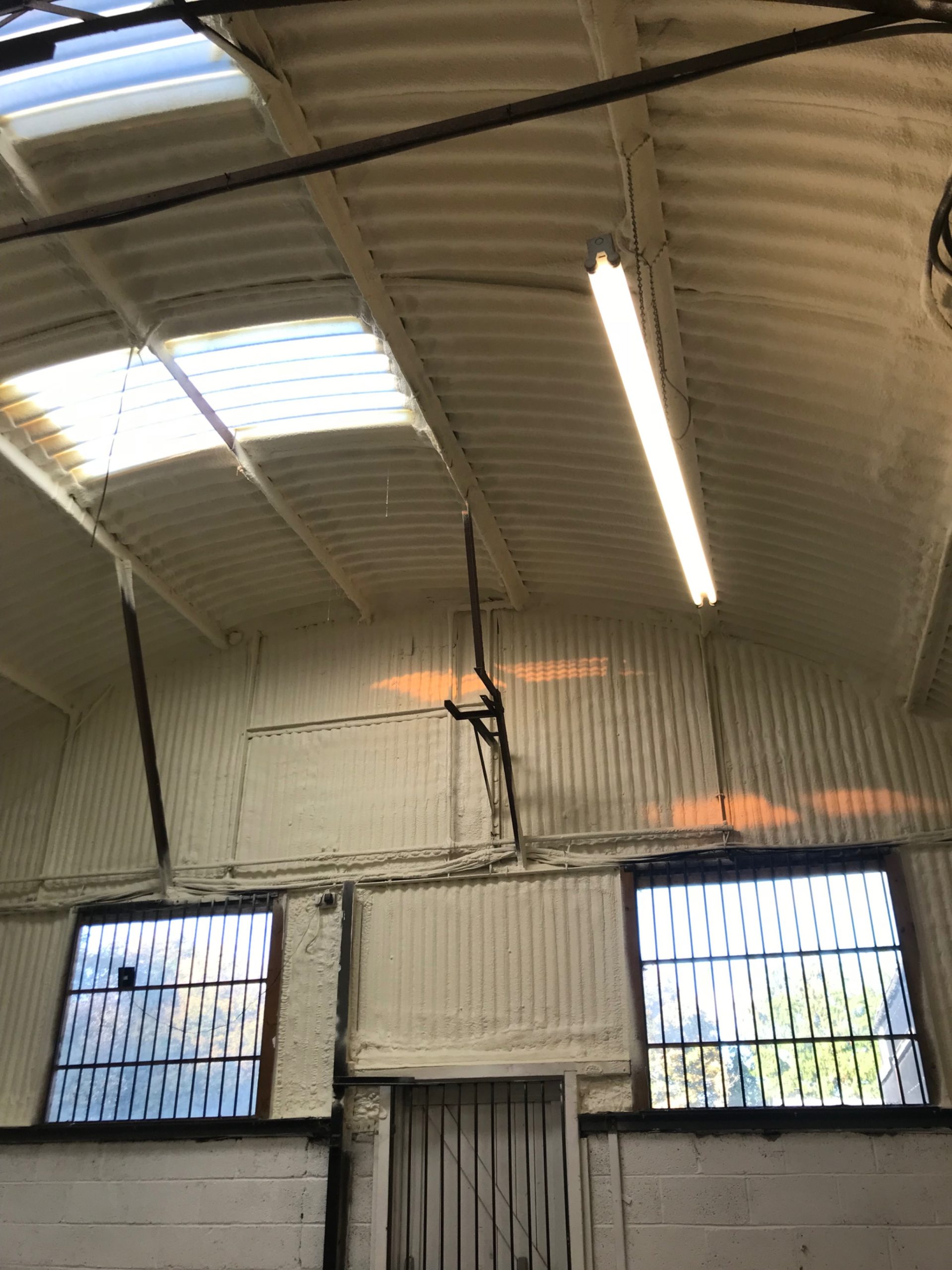Spray foam insulation on a steel-frame building